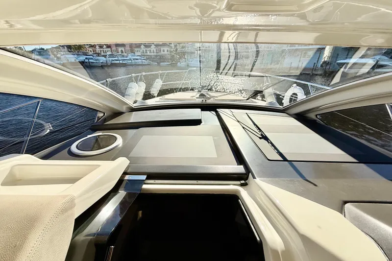 Slide: The Image of Interior view of 2016 Cranchi M44 HT yacht, showcasing sleek design and spacious layout. - 38