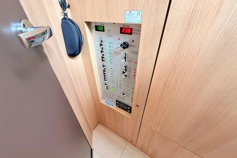 Slide: The Image of Electrical control panel on 2016 Cranchi M44 HT yacht interior. - 130