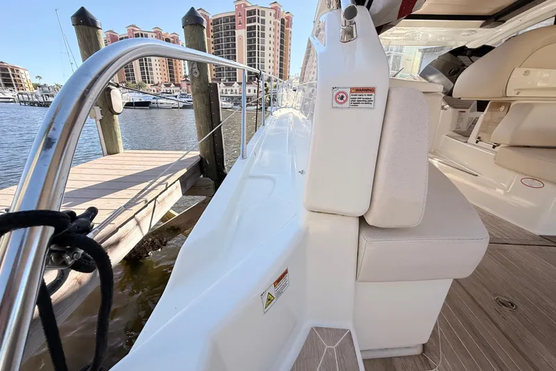 Slide: The Image of 2016 Cranchi M44 HT yacht docked at marina with luxury seating. - 155