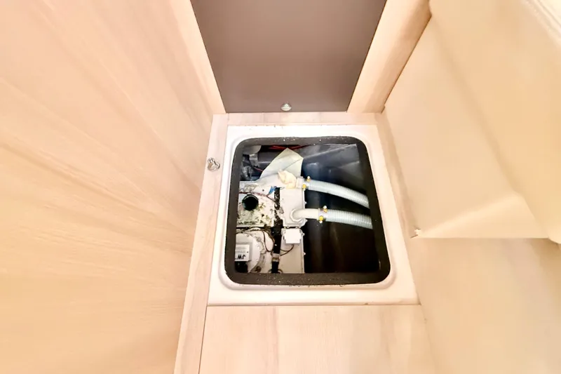 Slide: The Image of Engine compartment of 2016 Cranchi M44 HT yacht, showcasing internal components. - 75