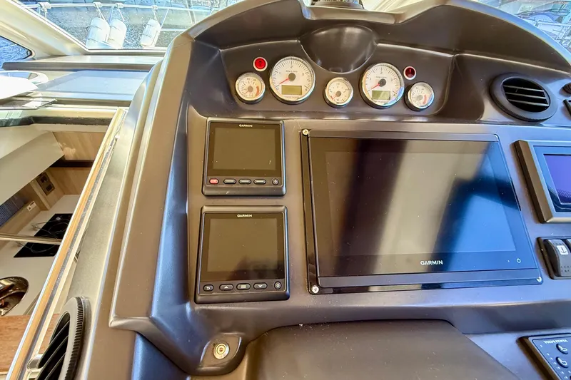 Slide: The Image of Control panel of 2016 Cranchi M44 HT yacht with Garmin displays and gauges. - 36