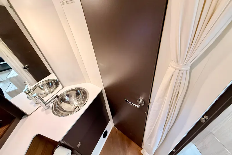 Slide: The Image of Luxurious bathroom interior of 2016 Cranchi M44 HT yacht with modern sink and fixtures. - 118