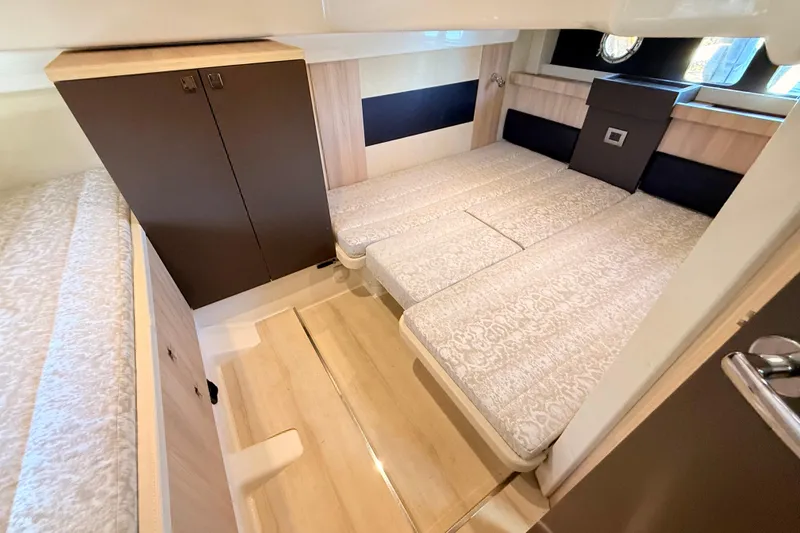 Slide: The Image of Interior of 2016 Cranchi M44 HT yacht with elegant bedding and wooden cabinetry. - 120