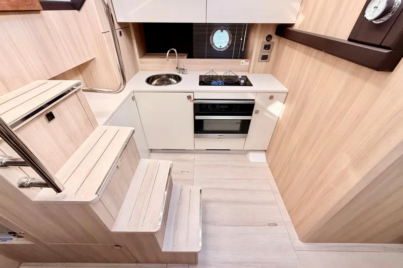 Slide: The Image of Modern kitchen interior of 2016 Cranchi M44 HT yacht with sleek design and compact layout. - 44