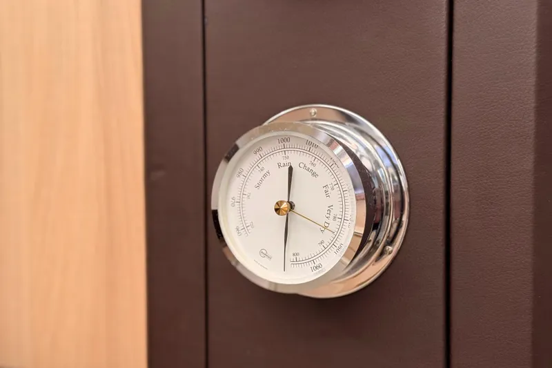 Slide: The Image of Barometer on 2016 Cranchi M44 HT yacht interior, indicating weather conditions. - 65