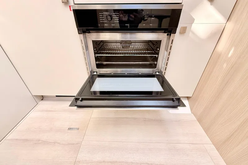 Slide: The Image of Open oven in Cranchi M44 HT yacht kitchen, 2016 model. - 62