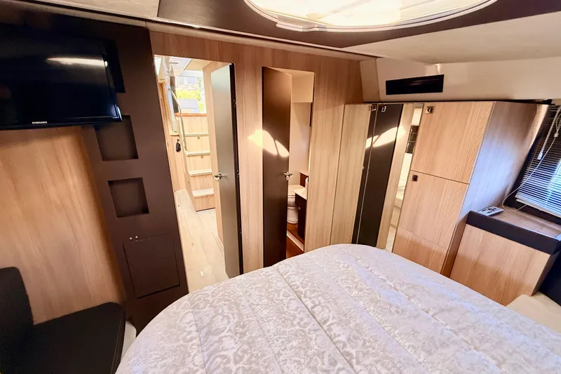 Slide: The Image of Luxurious interior of 2016 Cranchi M44 HT yacht with wood finishes and modern amenities. - 103
