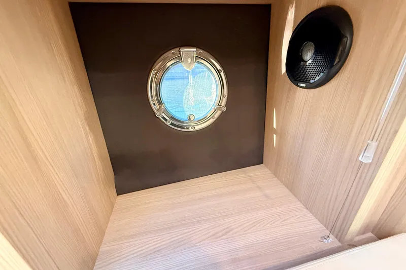 Slide: The Image of Interior of 2016 Cranchi M44 HT yacht with porthole and speaker. - 93