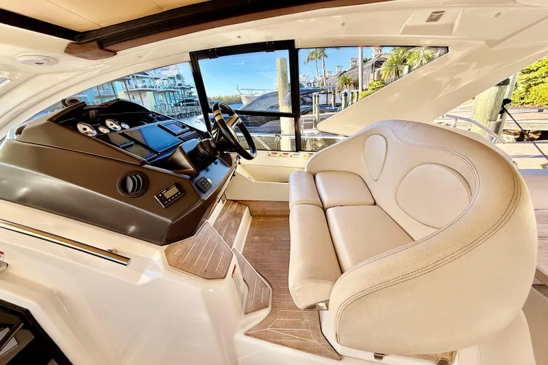Slide: The Image of Interior of 2016 Cranchi M44 HT yacht with helm and plush seating. - 27