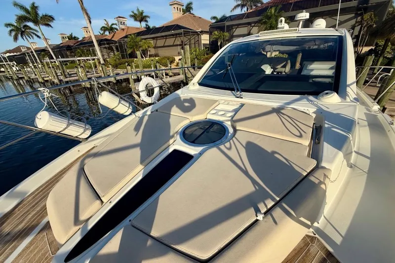 Slide: The Image of 2016 Cranchi M44 HT yacht docked, featuring sunbathing area and luxurious design. - 151