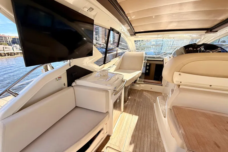 Slide: The Image of Luxurious interior of 2016 Cranchi M44 HT yacht with modern seating and large TV. - 18