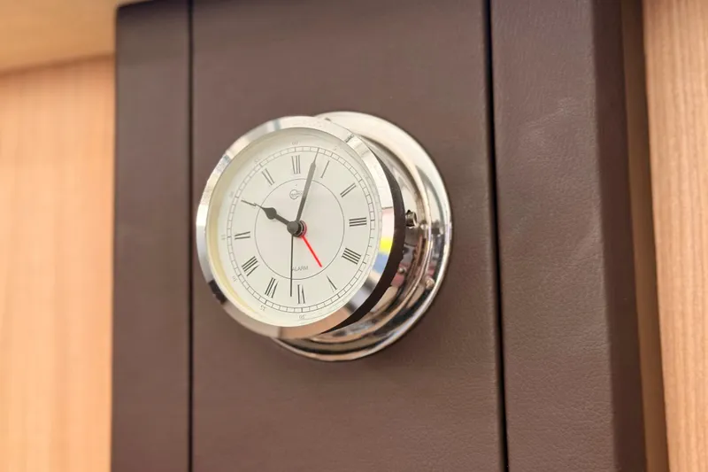 Slide: The Image of Chrome analog clock on 2016 Cranchi M44 HT yacht interior. - 67