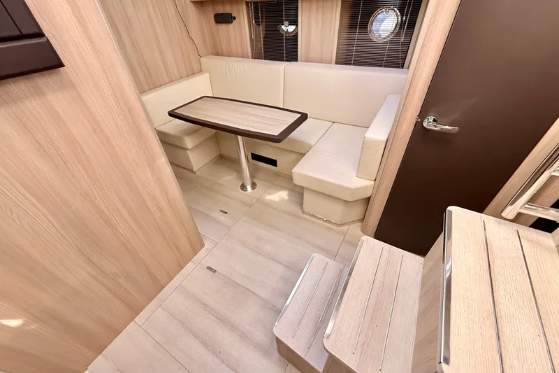 Slide: The Image of Interior of 2016 Cranchi M44 HT yacht with modern seating and wooden finishes. - 83