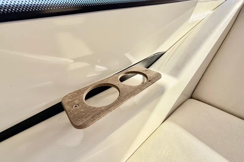 Slide: The Image of Interior detail of 2016 Cranchi M44 HT yacht, featuring a wooden cup holder. - 133