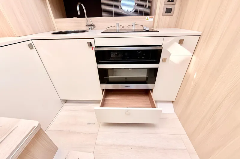 Slide: The Image of Modern kitchen interior of 2016 Cranchi M44 HT yacht with sleek cabinetry and appliances. - 63