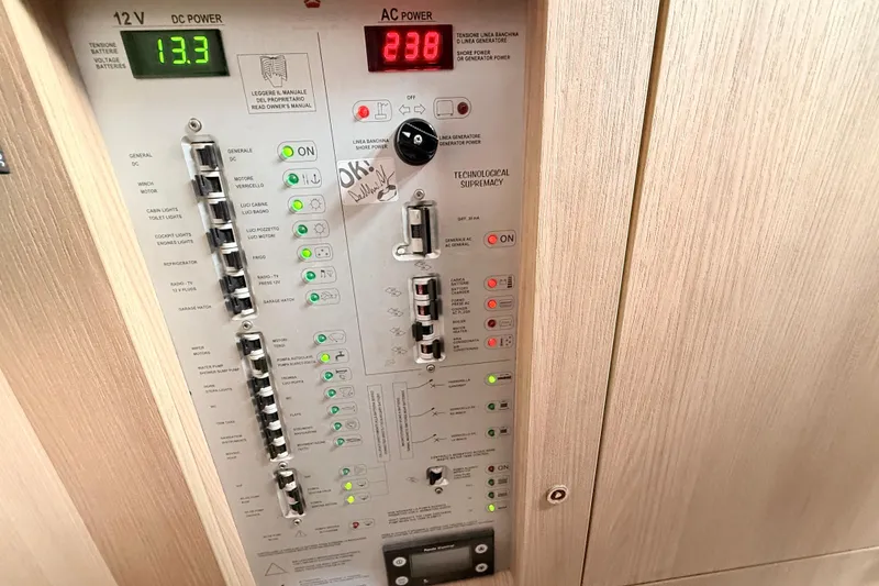 Slide: The Image of Control panel of a 2016 Cranchi M44 HT yacht, displaying DC and AC power readings. - 131