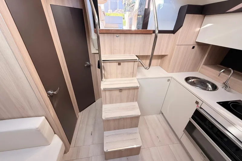 Slide: The Image of Modern interior of 2016 Cranchi M44 HT yacht with sleek kitchen and stairs. - 111