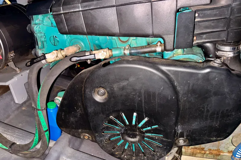 Slide: The Image of Engine compartment of a 2016 Cranchi M44 HT boat, showcasing mechanical components. - 163