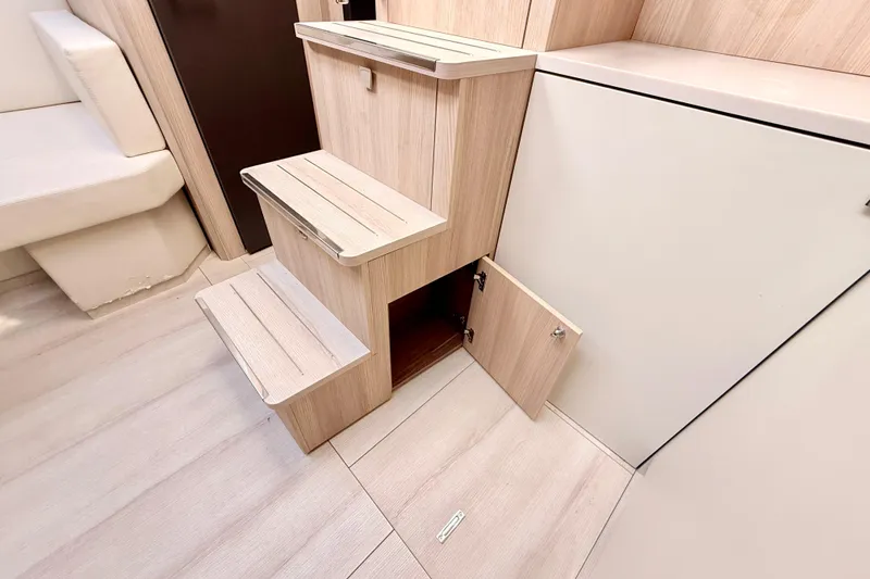 Slide: The Image of Interior of 2016 Cranchi M44 HT yacht with wooden steps and storage compartment. - 68