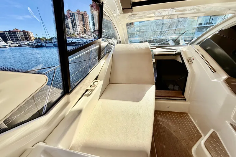 Slide: The Image of Interior view of 2016 Cranchi M44 HT yacht with marina backdrop. - 25