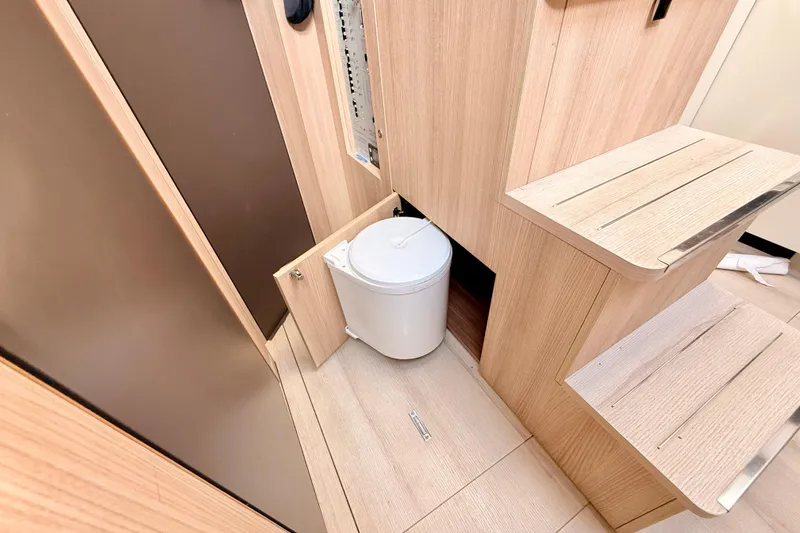 Slide: The Image of Interior of 2016 Cranchi M44 HT yacht with wooden cabinetry and hidden trash bin. - 129