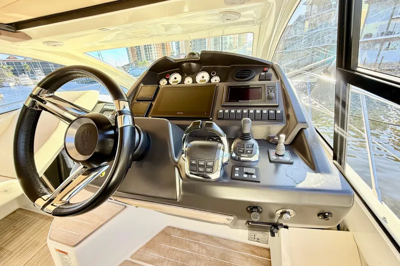 Slide: The Image of Helm of 2016 Cranchi M44 HT yacht with modern controls and steering wheel. - 30