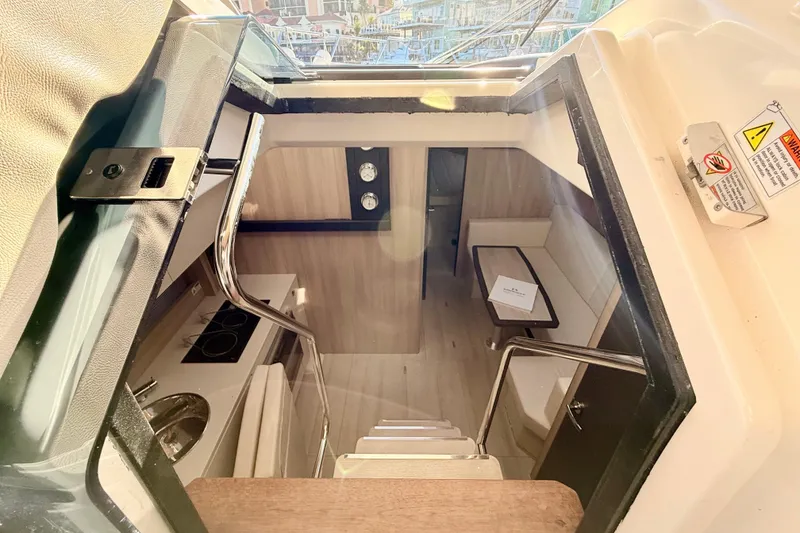 Slide: The Image of Interior view of 2016 Cranchi M44 HT yacht, featuring modern kitchen and seating area. - 41