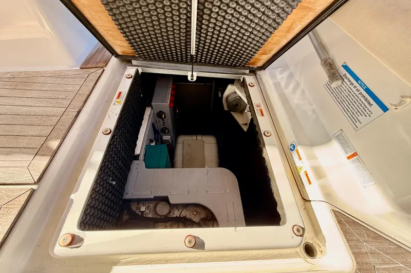 Slide: The Image of Engine compartment of 2016 Cranchi M44 HT yacht, showcasing interior components and insulation. - 158