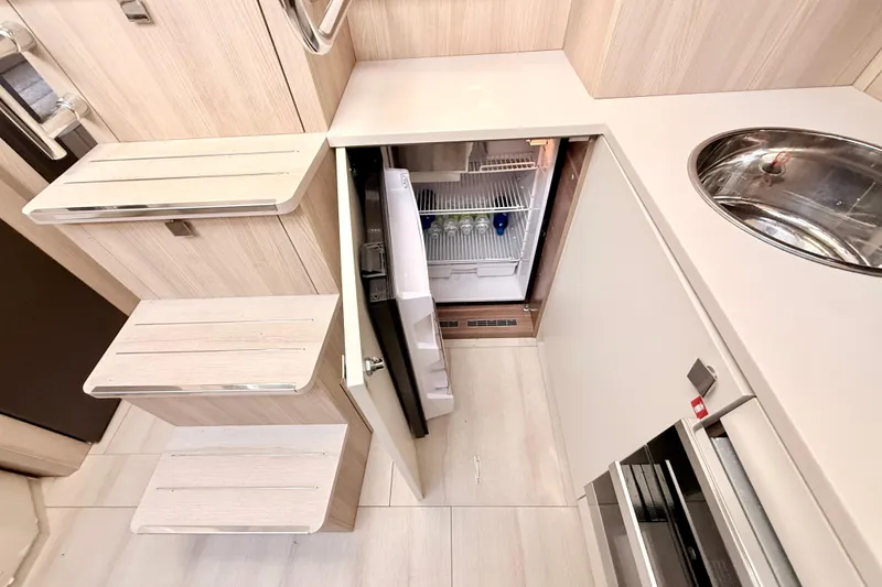 Slide: The Image of Modern kitchen area in 2016 Cranchi M44 HT yacht with fridge and sink. - 49
