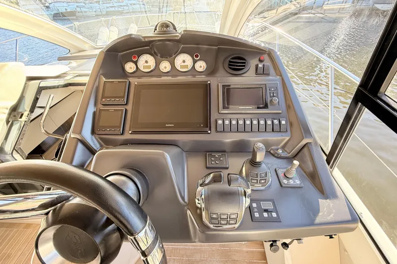 Slide: The Image of Helm of 2016 Cranchi M44 HT yacht with modern navigation controls and displays. - 31