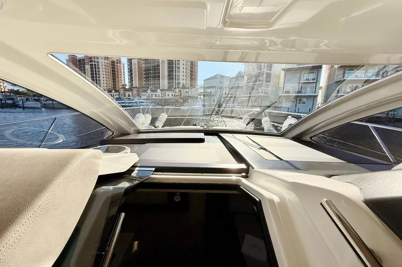 Slide: The Image of Interior view of 2016 Cranchi M44 HT yacht with marina backdrop. - 39