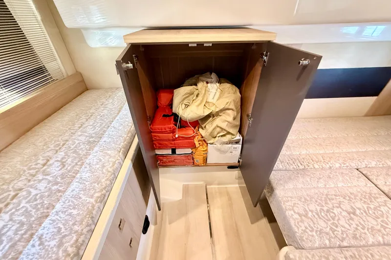 Slide: The Image of Storage cabinet in 2016 Cranchi M44 HT yacht, containing life jackets and safety equipment. - 122