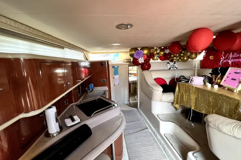 Slide: The Image of Luxurious 2002 Sea Ray 450 Express Bridge interior with festive decorations and elegant seating. - 24