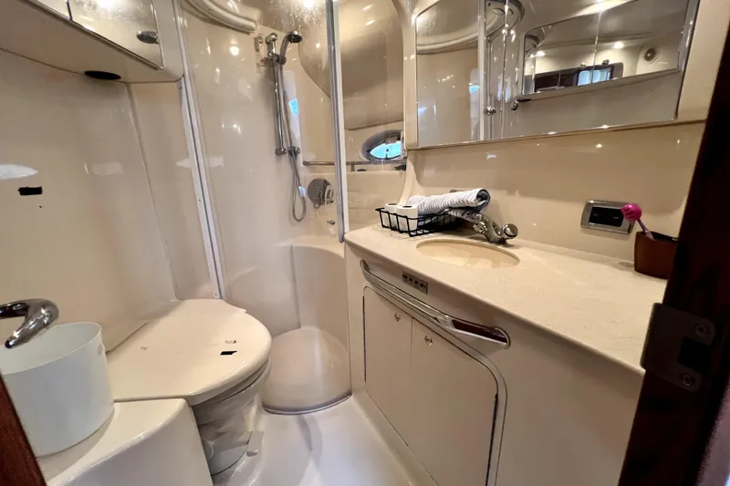Slide: The Image of Luxurious bathroom in 2002 Sea Ray 450 Express Bridge yacht with shower and vanity. - 36