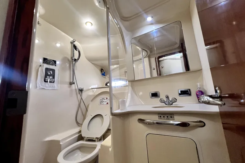 Slide: The Image of Luxurious bathroom in 2002 Sea Ray 450 Express Bridge yacht, featuring modern fixtures and lighting. - 33