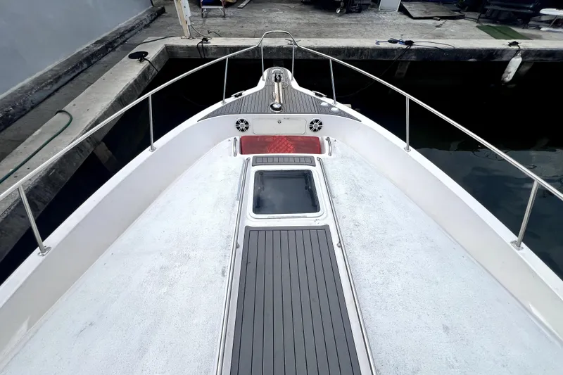 Slide: The Image of 2002 Sea Ray 450 Express Bridge yacht bow view at dock. - 47