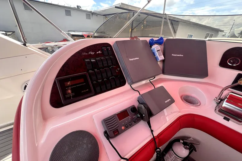 Slide: The Image of Control panel of a 2002 Sea Ray 450 Express Bridge with Raymarine equipment. - 42