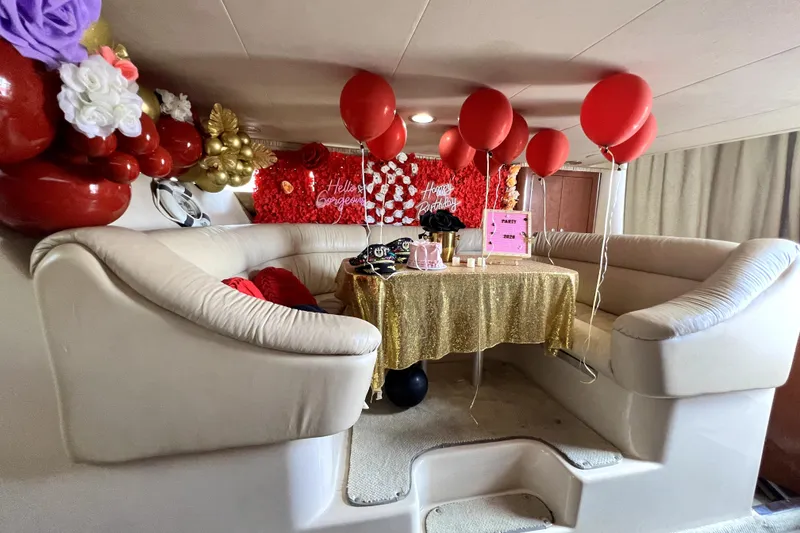 Slide: The Image of Luxurious 2002 Sea Ray 450 Express Bridge interior with festive birthday decorations and balloons. - 29