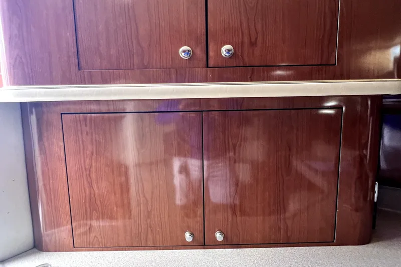 Slide: The Image of Wooden cabinetry on a 2002 Sea Ray 450 Express Bridge yacht interior. - 25