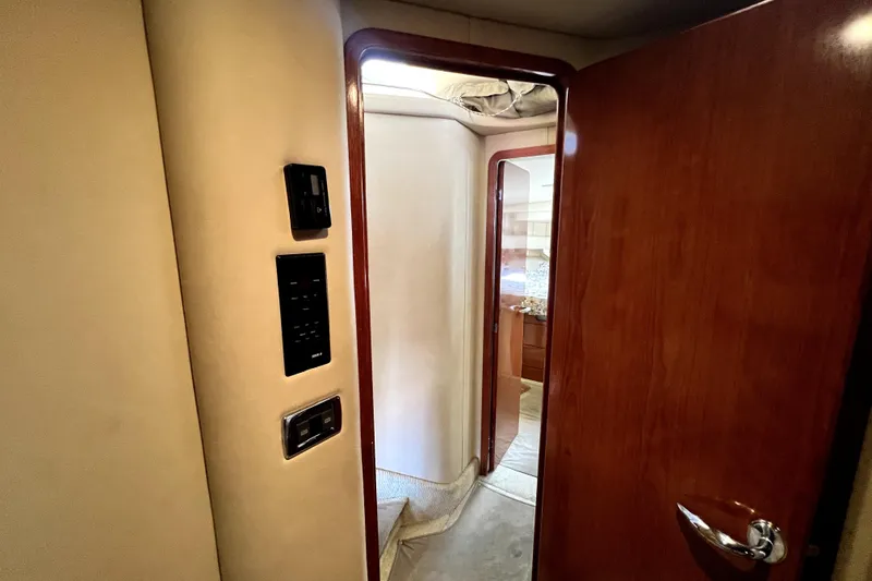 Slide: The Image of Interior view of 2002 Sea Ray 450 Express Bridge yacht cabin doorway. - 35
