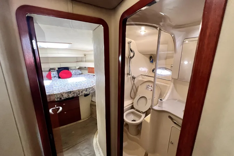 Slide: The Image of Interior of 2002 Sea Ray 450 Express Bridge showing bedroom and bathroom. - 17