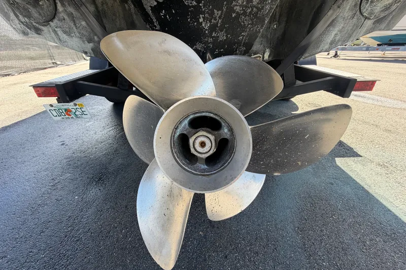 Slide: The Image of Propeller of a 2016 Glastron GT 245 boat on a trailer. - 5