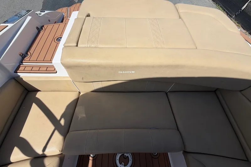 Slide: The Image of 2016 Glastron GT 245 boat with beige leather seating and teak-style flooring. - 70