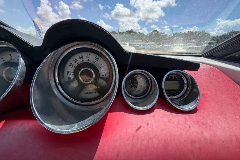 Slide: The Image of Dashboard of a 2016 Glastron GT 245 boat with speedometer and gauges. - 26