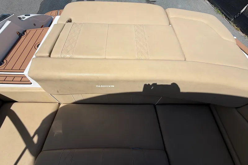 Slide: The Image of 2016 Glastron GT 245 boat with beige leather seating and wood accents. - 71
