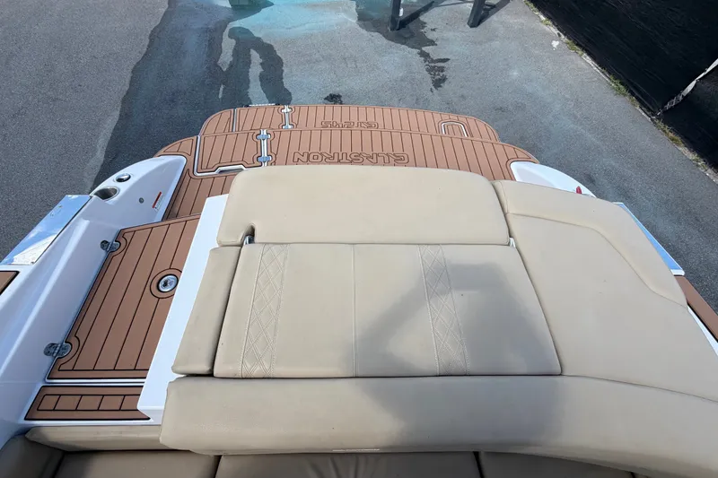 Slide: The Image of 2016 Glastron GT 245 boat with tan upholstery and teak-style deck. - 75