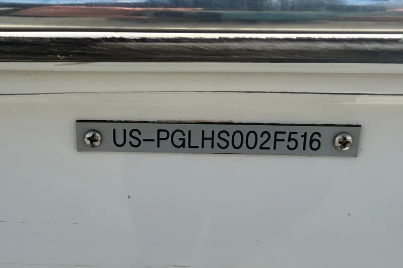 Slide: The Image of Hull identification number on 2016 Glastron GT 245 boat, labeled US-PGLHS002F516. - 81