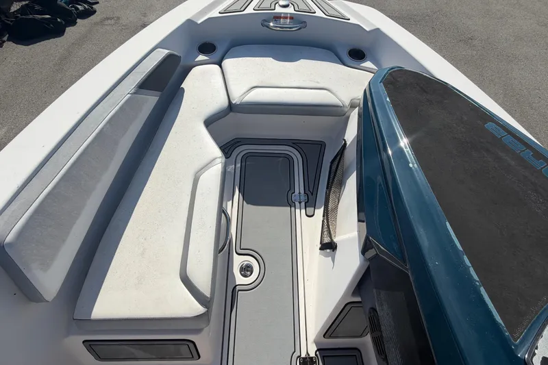 Slide: The Image of 2016 Scarab 165 boat interior with cushioned seating and sleek design. - 29