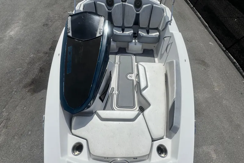 Slide: The Image of 2016 Scarab 165 boat interior with seating and storage, viewed from above. - 34