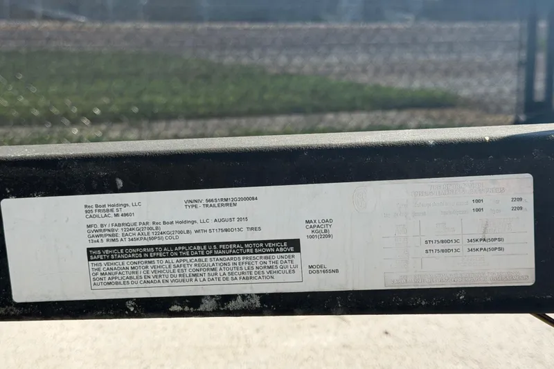 Slide: The Image of Label on a 2016 Scarab 165 trailer, detailing specifications and compliance information. - 55